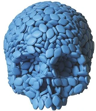 Pills arranged in the shape of a skull, symbolizing prescription medication risk